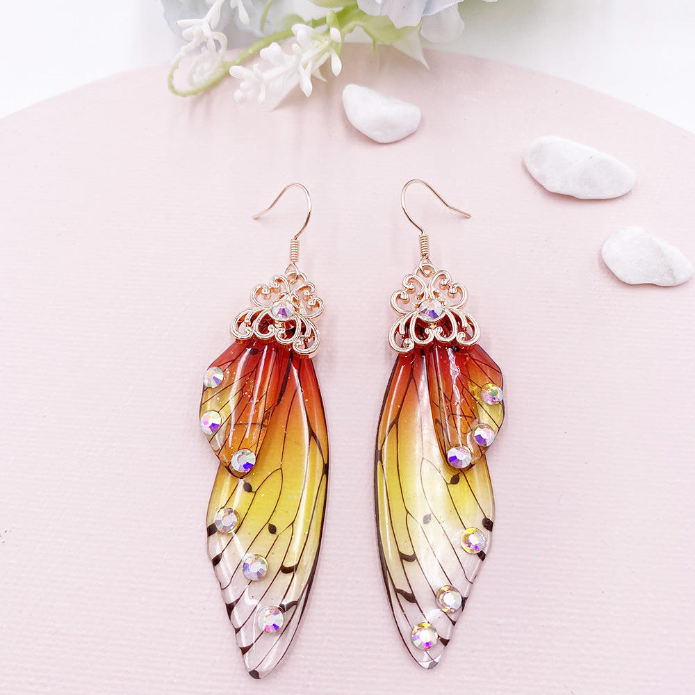 H386d0ca532994d6184f17758505981605 Korean Temperament Long Butterfly Earring Orange Code-261b - Image 1